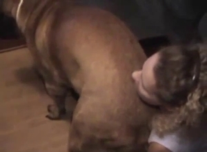 Woman gets on her knees so she can seduce a puppy